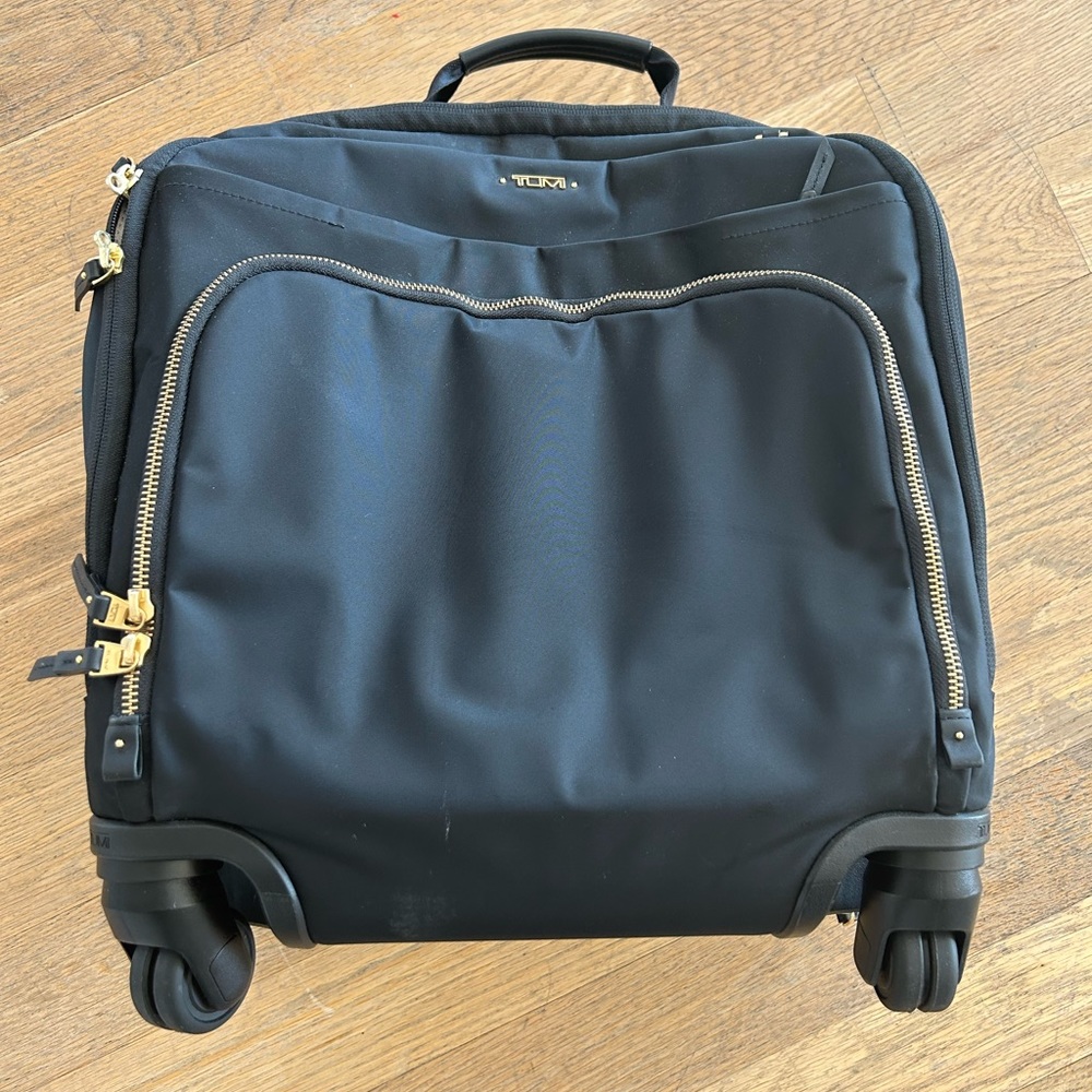 Unused Tumi Carry on black with gold trim